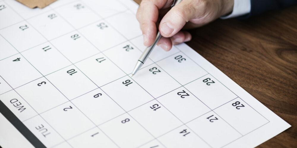 Businessman marking on calendar for an appointment